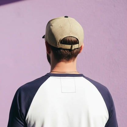 Person wearing a beige cap and a two-tone shirt against a purple background